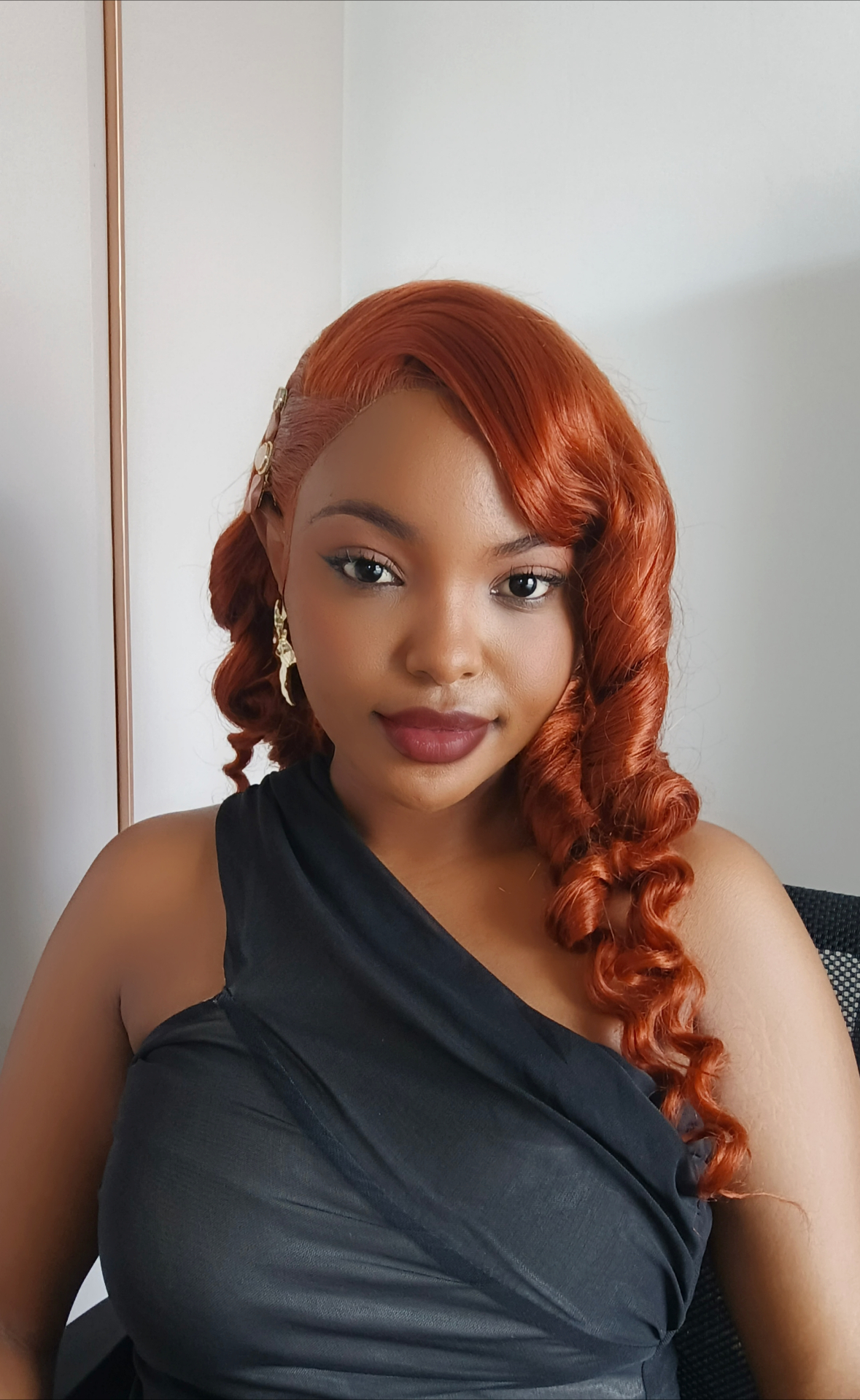 African woman wearing a luxury ginger wig from Wigs by Cashy